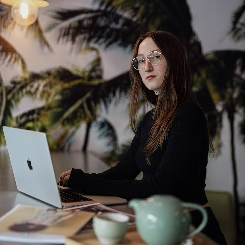Olena working at a laptop